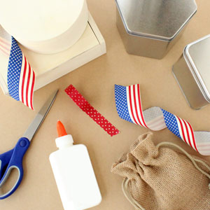 scissors, glue, patriotic ribbon, and containers to wrap