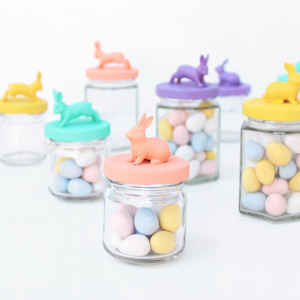 glass jars decorated with paint and animals